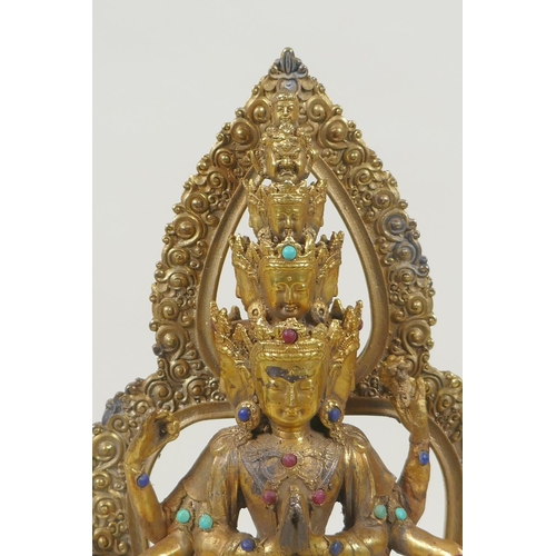 162 - A Tibetan gilt bronze figure of Avalokiteshvara, set with multi-colour hardstones, 28cm high