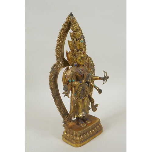 162 - A Tibetan gilt bronze figure of Avalokiteshvara, set with multi-colour hardstones, 28cm high