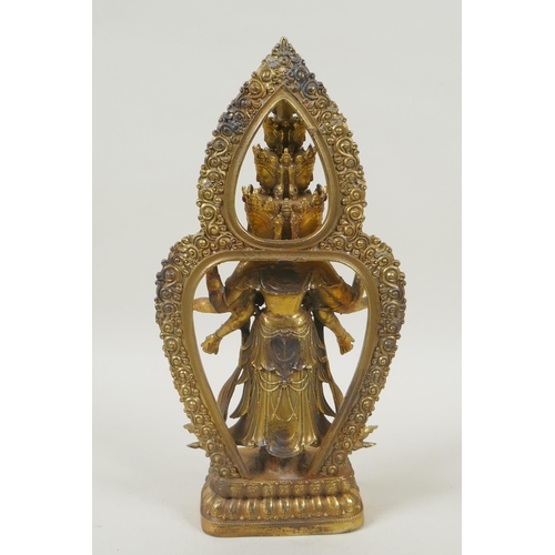 162 - A Tibetan gilt bronze figure of Avalokiteshvara, set with multi-colour hardstones, 28cm high