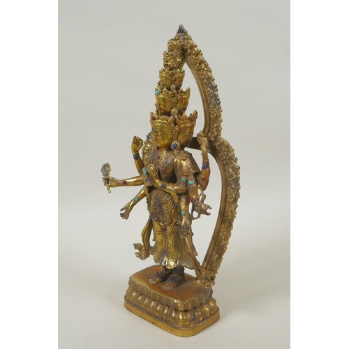 162 - A Tibetan gilt bronze figure of Avalokiteshvara, set with multi-colour hardstones, 28cm high