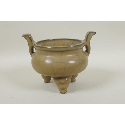 163 - A Chinese Ge ware pottery censer on tripod supports with two handles, 13cm high