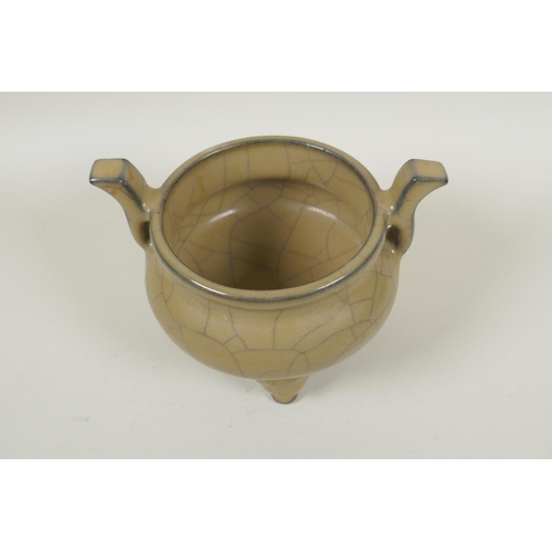 163 - A Chinese Ge ware pottery censer on tripod supports with two handles, 13cm high