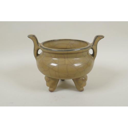 163 - A Chinese Ge ware pottery censer on tripod supports with two handles, 13cm high