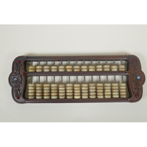 165 - A Chinese carved hardwood and hardstone beaded abacus, 41 x 14cm