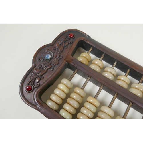 165 - A Chinese carved hardwood and hardstone beaded abacus, 41 x 14cm