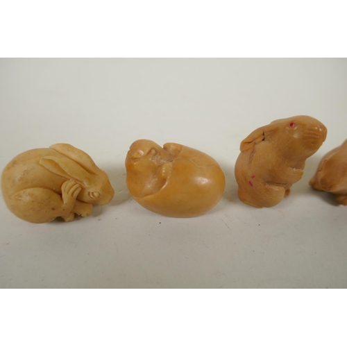 167 - Four Japanese carved tagua nut netsuke in the form of three rabbits and chick, largest 4cm