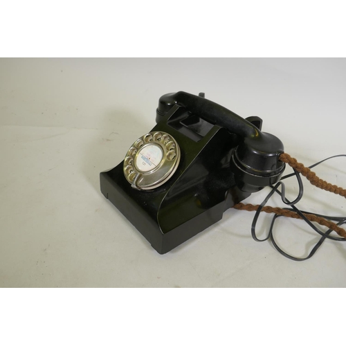 169 - A vintage bakelite telephone