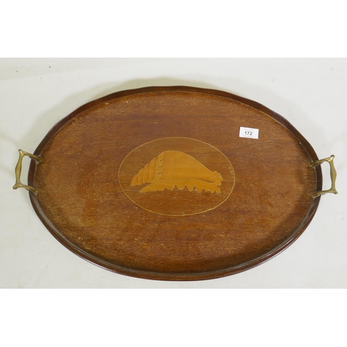 172 - An Edwardian mahogany oval serving tray with shaped gallery, brass handles and shell inlaid decorati... 