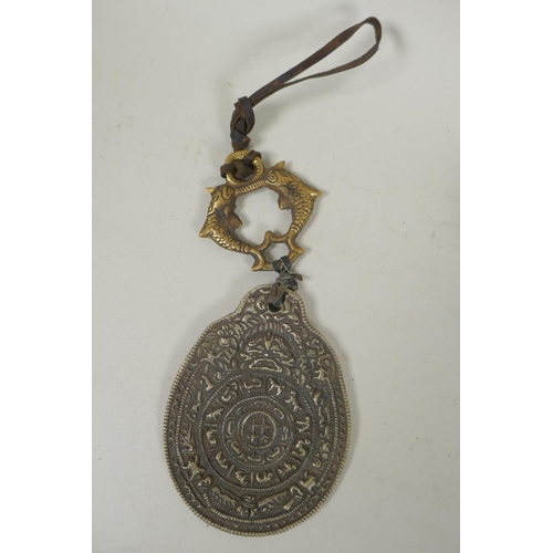 182 - A Tibetan gilt bronze vajra, 15cm long, and a white metal mirror and zodiac calendar