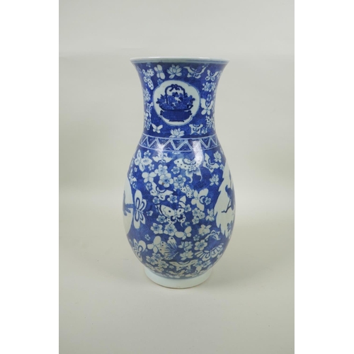 183 - A Chinese Republic blue and white porcelain vase with decorative panels depicting birds within a fie... 