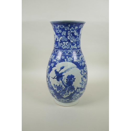 183 - A Chinese Republic blue and white porcelain vase with decorative panels depicting birds within a fie... 