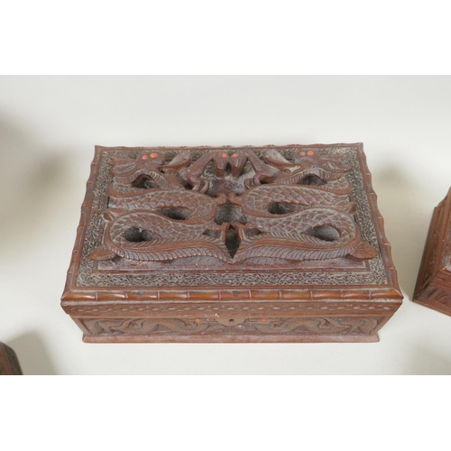 185 - A collection of C19th and C20th Burmese carved camphor wood and hardwood jewellery boxes with dragon... 