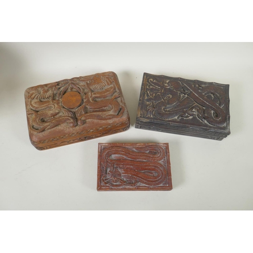 185 - A collection of C19th and C20th Burmese carved camphor wood and hardwood jewellery boxes with dragon... 