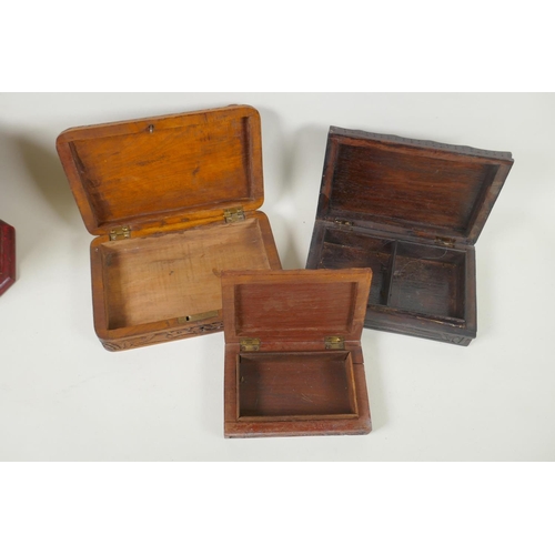 185 - A collection of C19th and C20th Burmese carved camphor wood and hardwood jewellery boxes with dragon... 