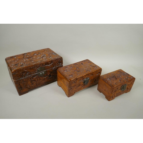 186 - A collection of C19th and C20th Chinese carved camphor wood and hardwood jewellery boxes with dragon... 