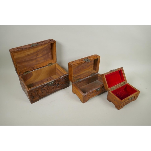 186 - A collection of C19th and C20th Chinese carved camphor wood and hardwood jewellery boxes with dragon... 