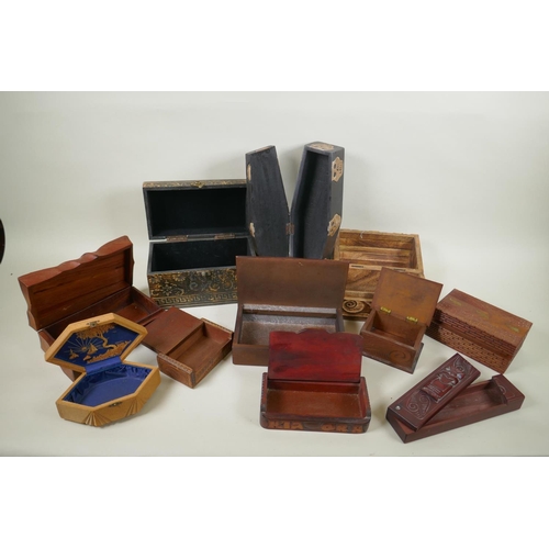 187 - A quantity of Tiki and Indian hardwood and cork jewellery/trinket boxes of assorted sizes and design... 