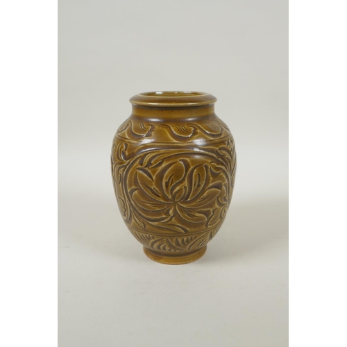 188 - A Chinese Song style olive glazed pottery vase with incised floral decoration, 15cm high