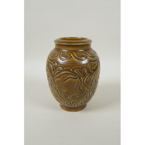 188 - A Chinese Song style olive glazed pottery vase with incised floral decoration, 15cm high