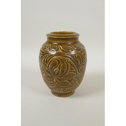 188 - A Chinese Song style olive glazed pottery vase with incised floral decoration, 15cm high