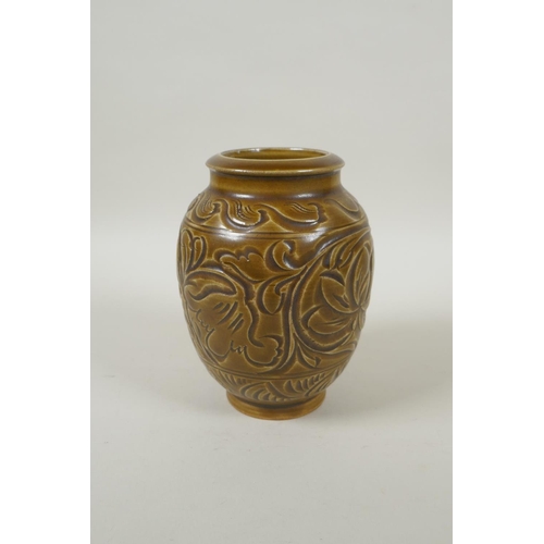 188 - A Chinese Song style olive glazed pottery vase with incised floral decoration, 15cm high