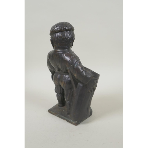 190 - A bronze desk stand in the form of a golfer, 19cm high