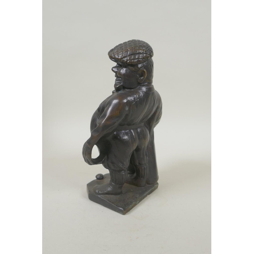 190 - A bronze desk stand in the form of a golfer, 19cm high