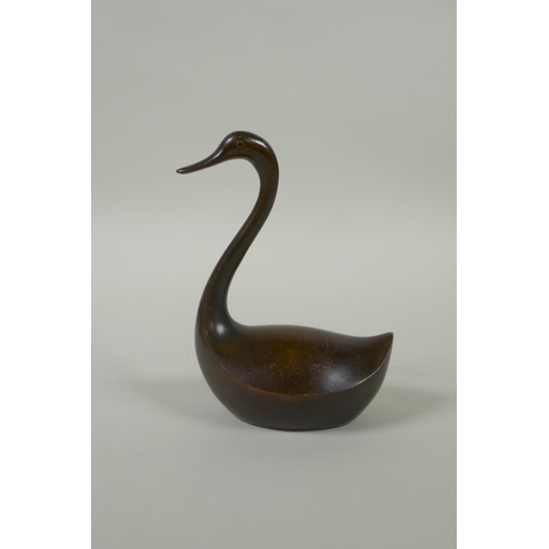 191 - An oriental bronze figure of a stylised duck, 10cm high