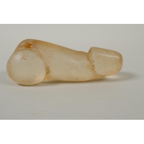 192 - An Oriental carved crystal phallic shaped pendant, 8cm