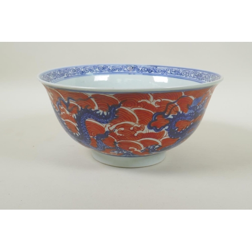 193 - A Chinese blue and white porcelain bowl decorated with dragons on red saves, Xuande 6 character mark... 