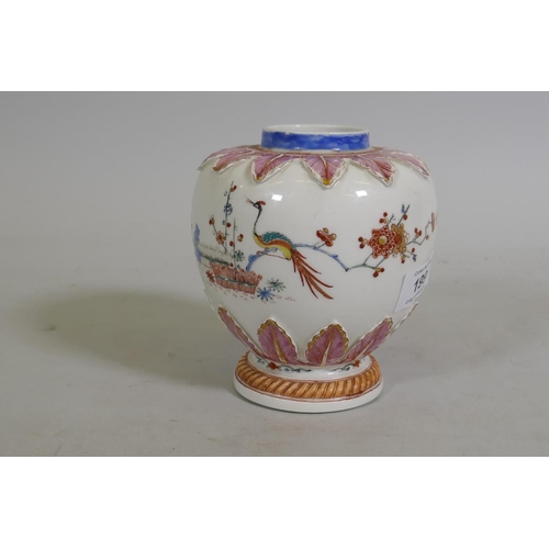 199 - An early C18th Meissen tea caddy with Kakiemon decoration, painted with phoenix amongst blossoms and... 