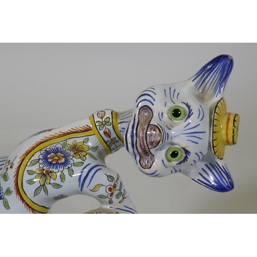 2 - A vintage French faience figure of a cat in a hat, with glass eyes, 20cm high