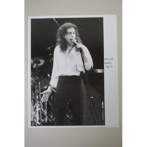 203 - A black and white photograph of Patti Smith at Wembley Arena, 1979, photographed by Jill Furmanovsky... 