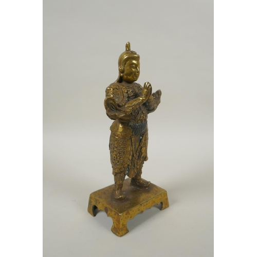 208 - A Chinese gilt bronze figure of Wei Tuo Pusa, impressed 4 character mark verso, 23cm high