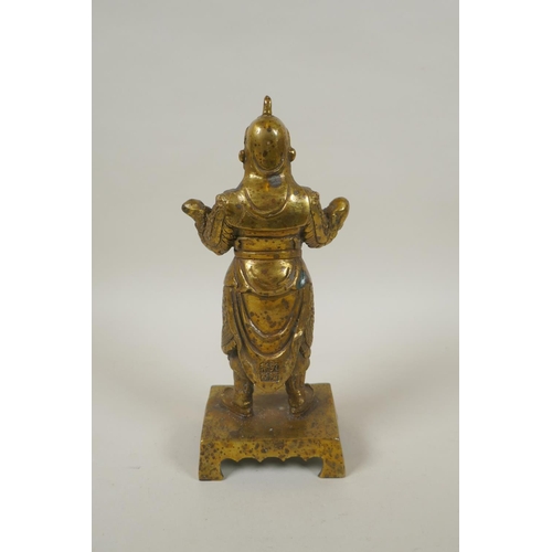 208 - A Chinese gilt bronze figure of Wei Tuo Pusa, impressed 4 character mark verso, 23cm high