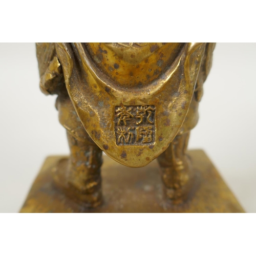 208 - A Chinese gilt bronze figure of Wei Tuo Pusa, impressed 4 character mark verso, 23cm high