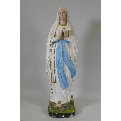 21 - An antique painted plaster figure of the Madonna, 95cm high, AF