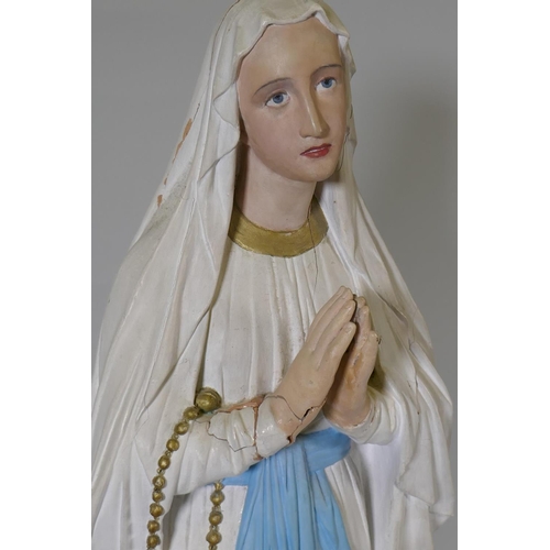 21 - An antique painted plaster figure of the Madonna, 95cm high, AF