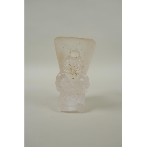 212 - A Chinese moulded glass libation cup with figural decoration, 10cm high