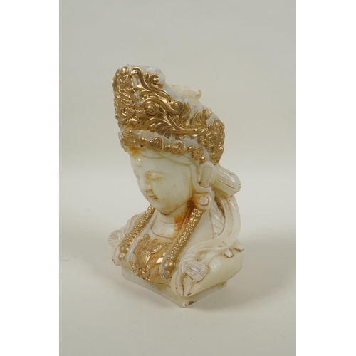 215 - A Chinese carved hardstone bust of Quan Yin, with gilt painted highlights, 20cm high