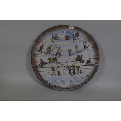 22 - A decorative painted pine panel celebrating French winter sports, 64cm diameter