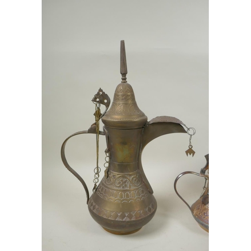 224 - A middle eastern brass coffee pot with chased decoration, a smaller white metal coffee pot and an an... 