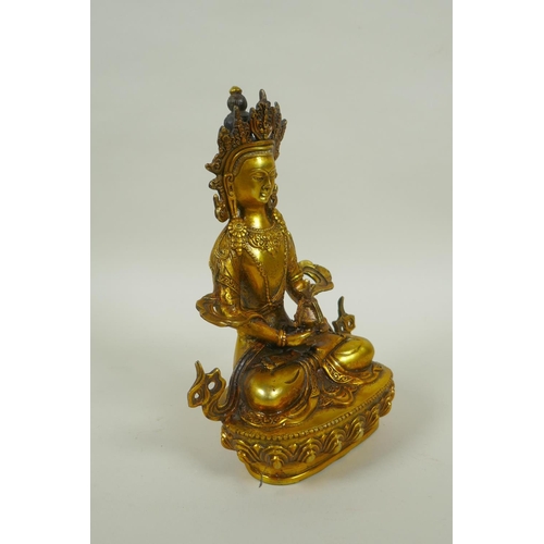 225 - A Sino Tibetan gilt metal Buddha seated on a lotus pond, impressed double vajra mark to base, 20cm h... 