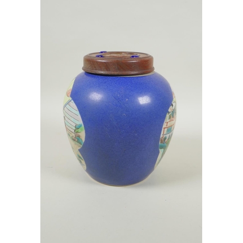 228 - An early C20th Chinese blue ground porcelain ginger jar and wooden cover, the vase with famille vert... 