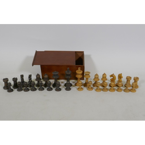 23 - An antique box wood chess set, in mahogany case, king 7.5cm high