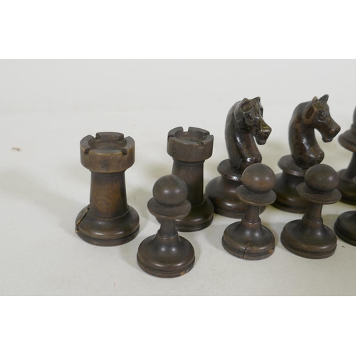 23 - An antique box wood chess set, in mahogany case, king 7.5cm high