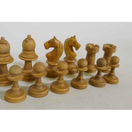 23 - An antique box wood chess set, in mahogany case, king 7.5cm high