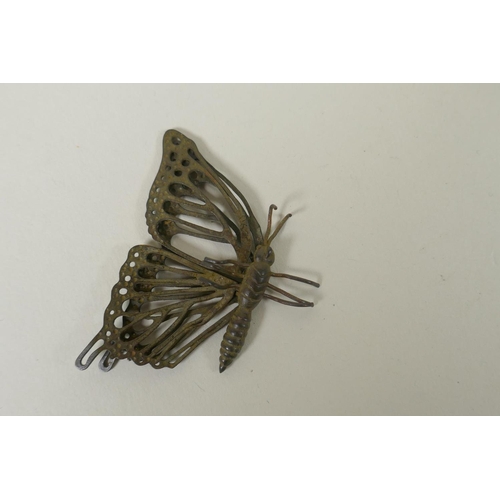 230 - A Japanese style bronze okimono butterfly with articulated wings, 8 x 6cm