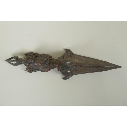 232 - A Tibetan ceremonial bronze vajra with the remnants of gilt patina, 29cm long