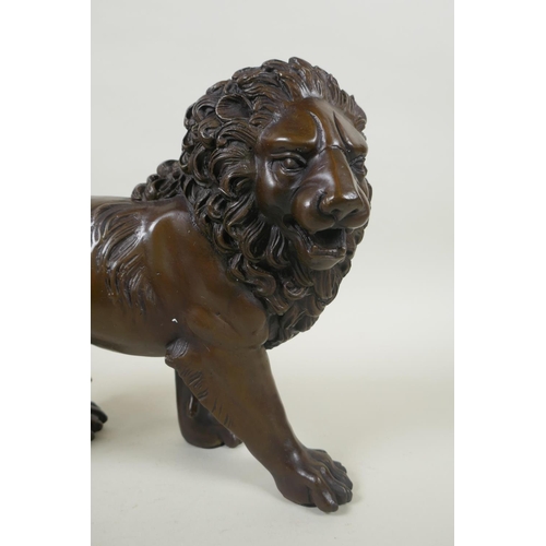 234 - A filled bronze lion, 31cm long